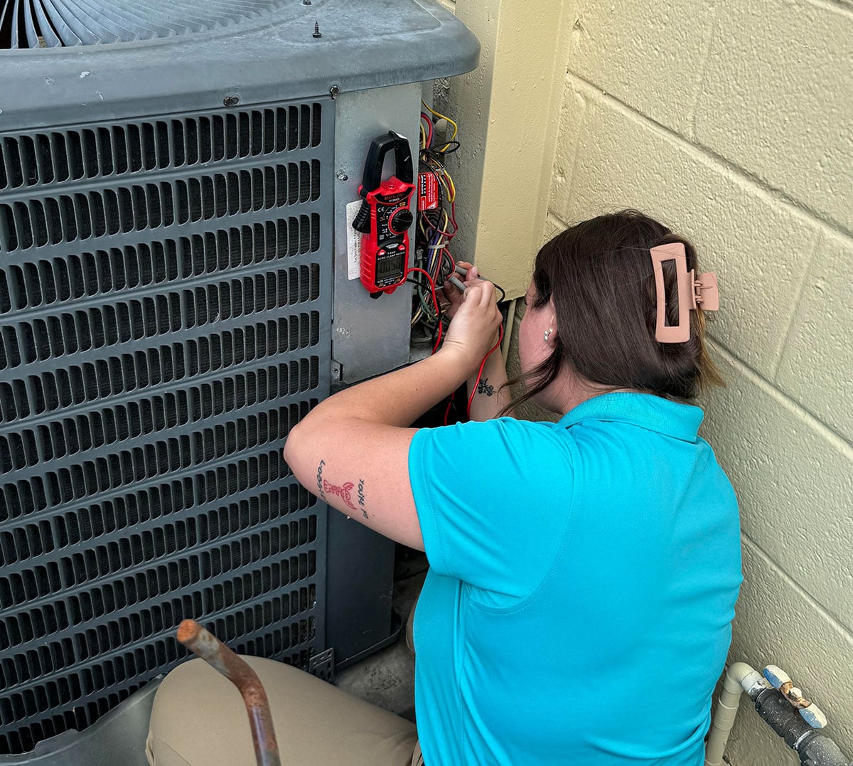 Natalee checking electric on condenser