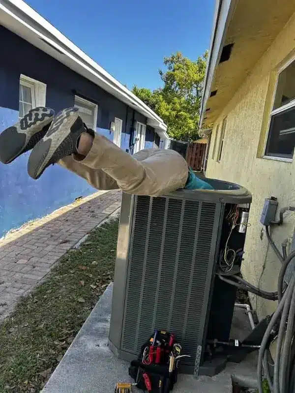 Quick Fix Air Repair technician performing emergency AC repair in Pembroke Pines